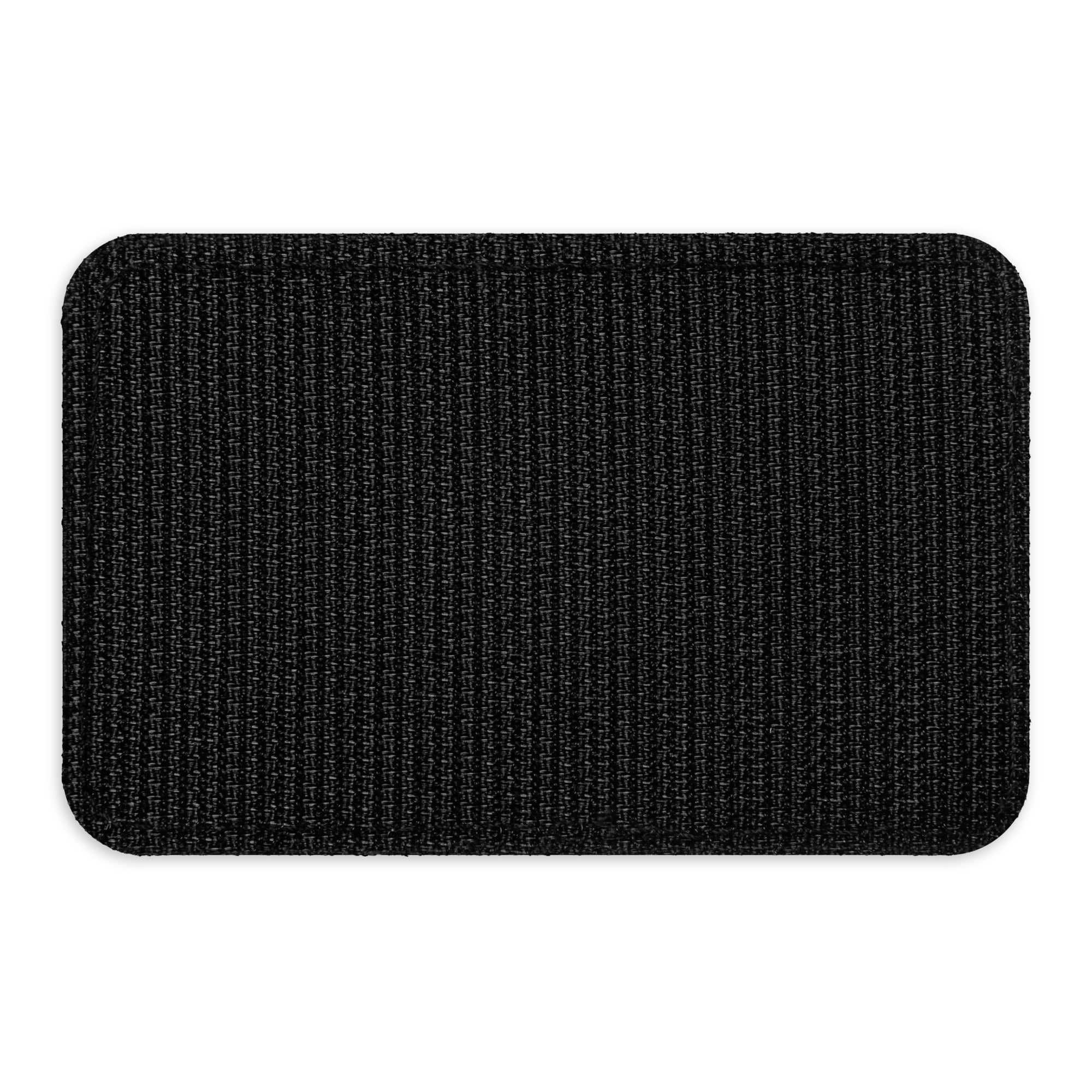 Back view of the black hook backing on the KTT Goods Co. Old Gold hook-and-loop patch